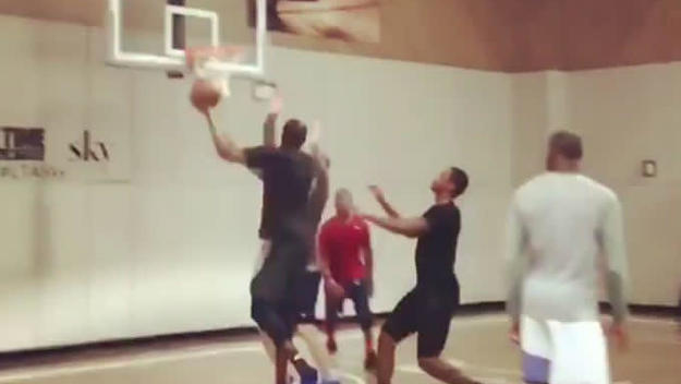 A crew of NBA stars plays a pickup game at a local gym.