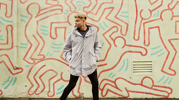 Jason Johannisen in front of Keith Haring mural