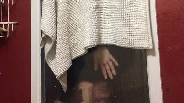 A woman gets stuck in a bathroom window after attempting to throw her poop out of it.