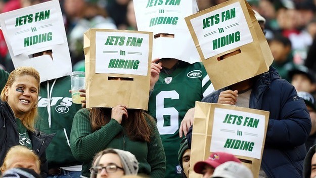 Jets fans with bags on their heads.
