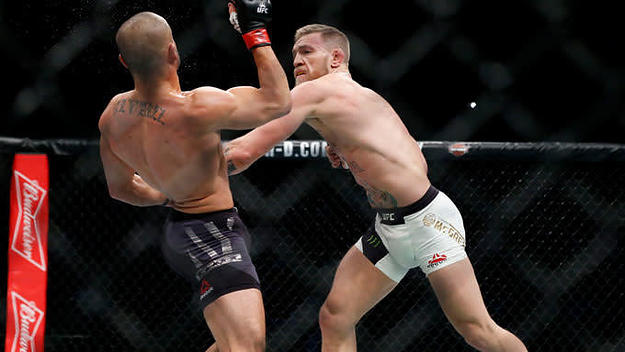 Conor McGregor fights Eddie Alvarez in their lightweight title bout during UFC 205.