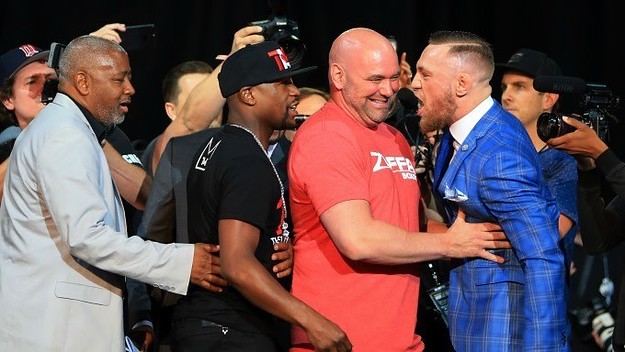 Conor McGregor yells at Floyd Mayweather.
