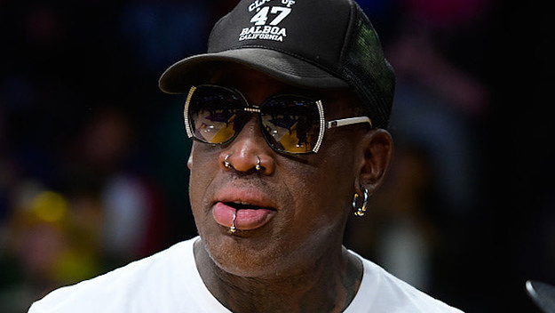 Dennis Rodman attends a basketball game