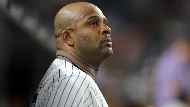 Yankess pitcher CC Sabathia stands in the dugout during a 2017 game.