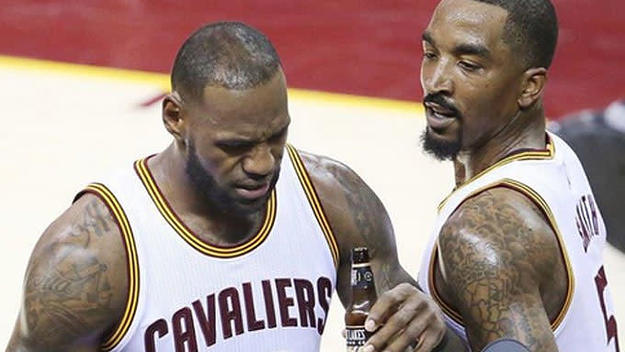 LeBron James pretends to sip a beer after he's fouled against the Raptors.