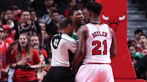 Jimmy Butler and Marcus Smart butt heads on the court.