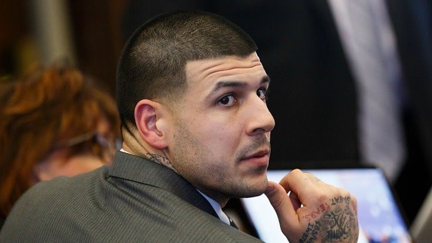 Aaron Hernandez listens during his double murder trial.