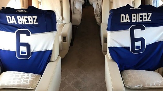 Justin Bieber shows off his custom Maple Leafs jerseys.