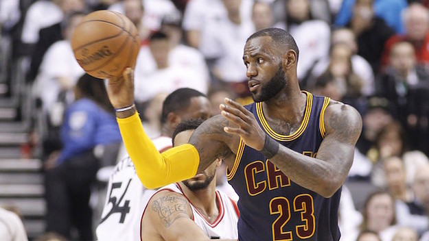 LeBron James passing off to teammate during game.