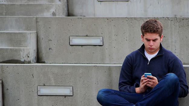 Some guy texting by himself.