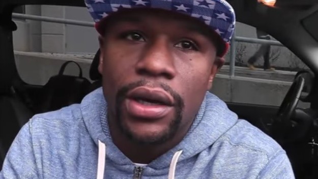 Floyd Mayweather gives advice to Ronda Rousey.