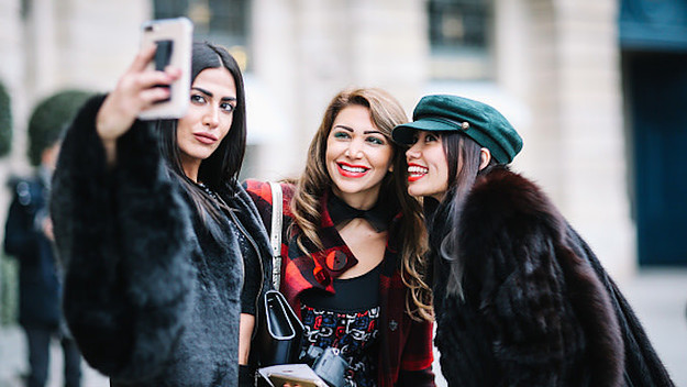 Soraya Shawsky, Maya Williams, and Thythu take a selfie, outside the Alexis Mabille show
