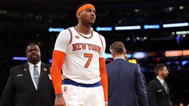 Carmelo Anthony walks off the court in disgust.