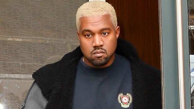 Kanye West walks on the street.
