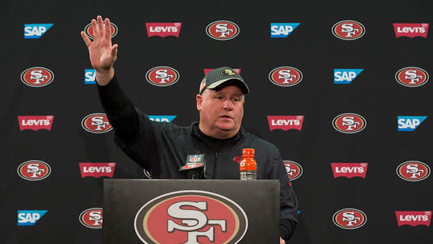 Chip Kelly waves goodbye to the press after his final press conference as the 49ers coach.