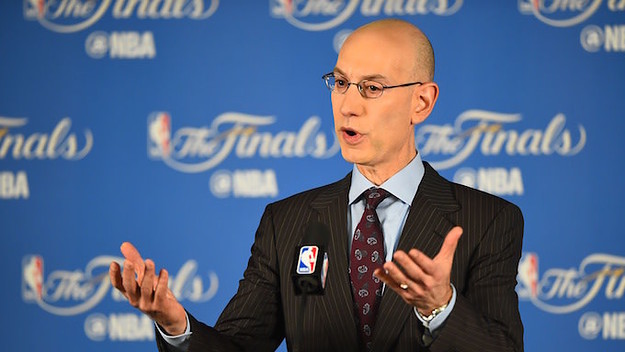 Adam Silver speaks at the podium.