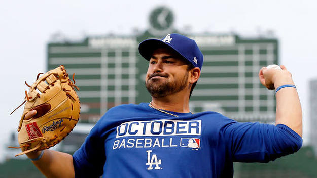 Adrian Gonzalez warms up before the Dodgers play the Cubs at Wrigley Field.