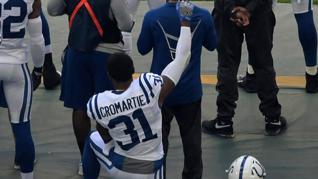 Antonio Cromartie kneels in protest during the National Anthem.