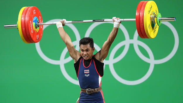 Sinphet Kruithong competes during the 56 kg weightlifting event.