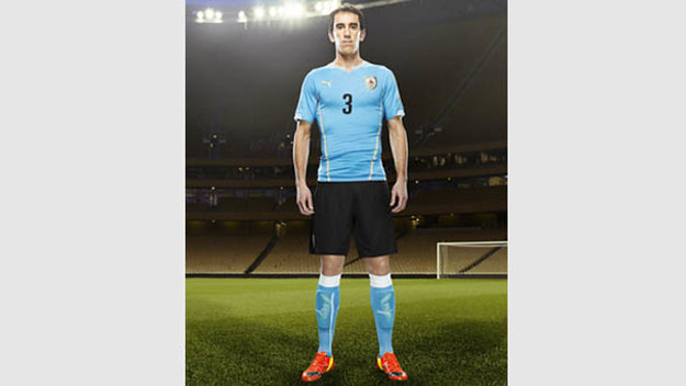 Diego Godín in the 2014 Uruguay Home Kit that features PUMA's PWR ACTV Technology