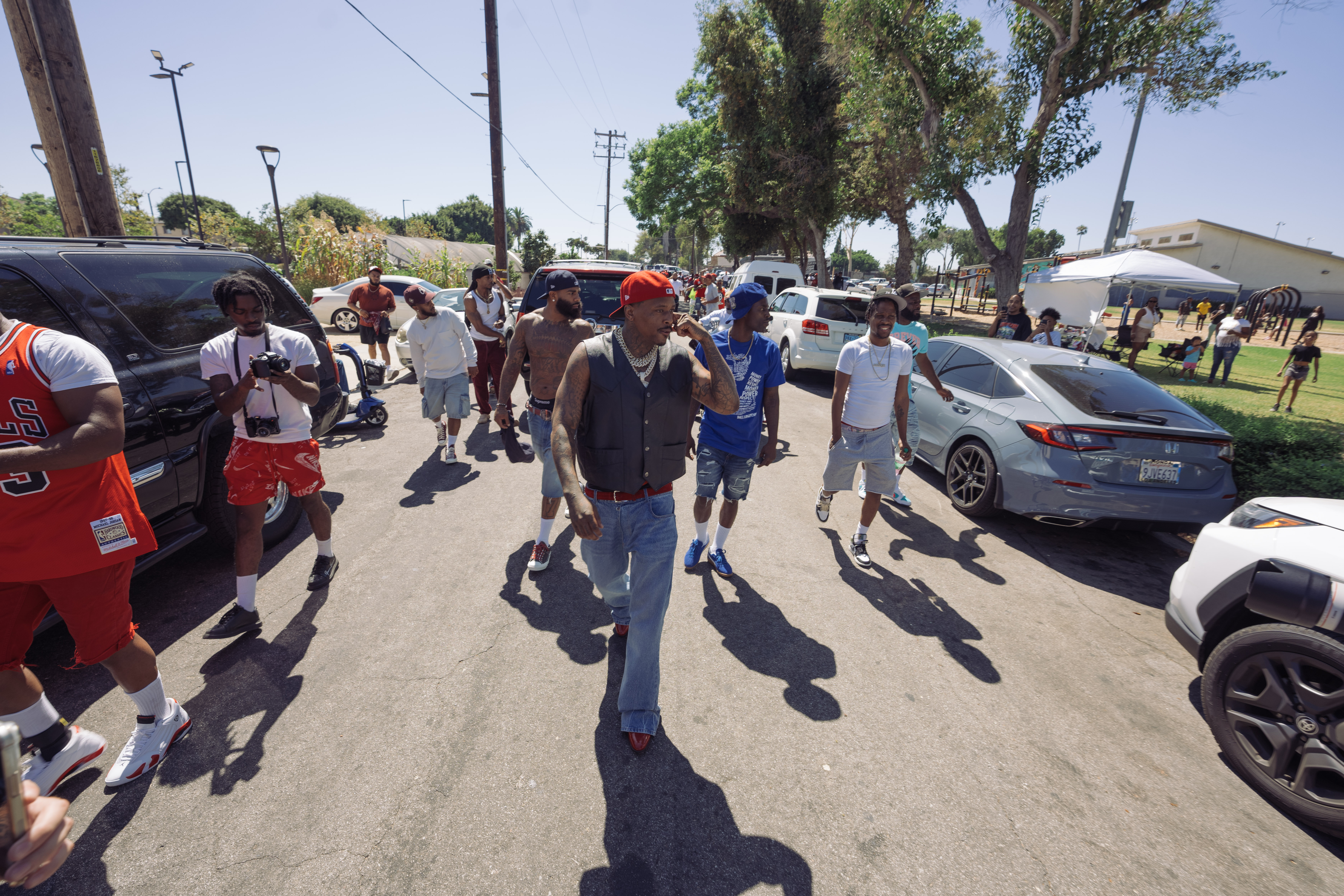 YG leads a walk uniting rivaling Pirus gangs in a compton peace walk.