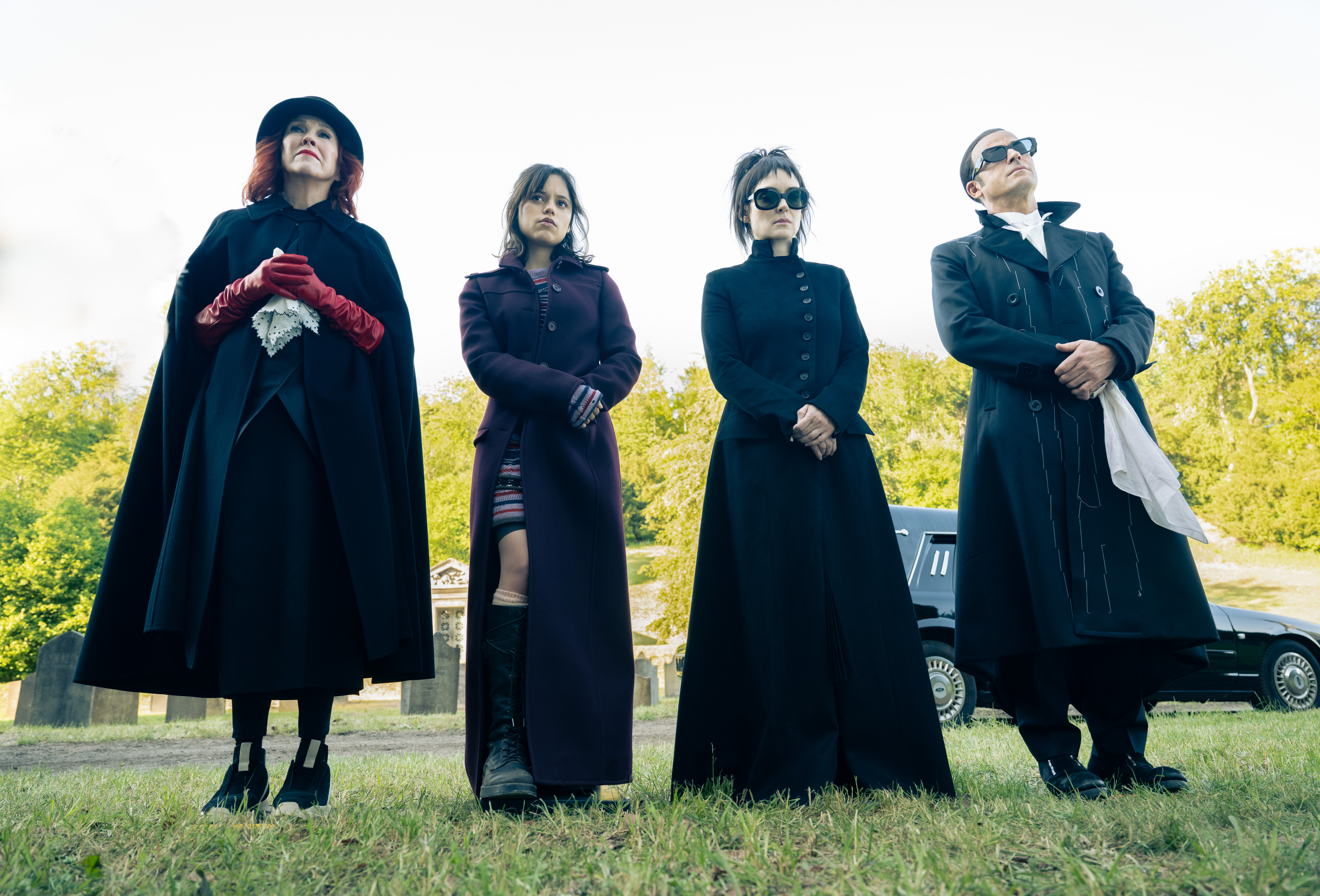 Catherine O'Hara (left), Jenna Ortega (center left), Winona Ryder (center right), Justin Theroux (right)( all stand together in Beetlejuice Beetlejuice