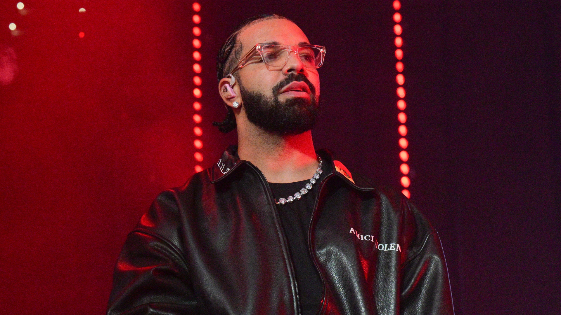 Drake performing at a concert.
