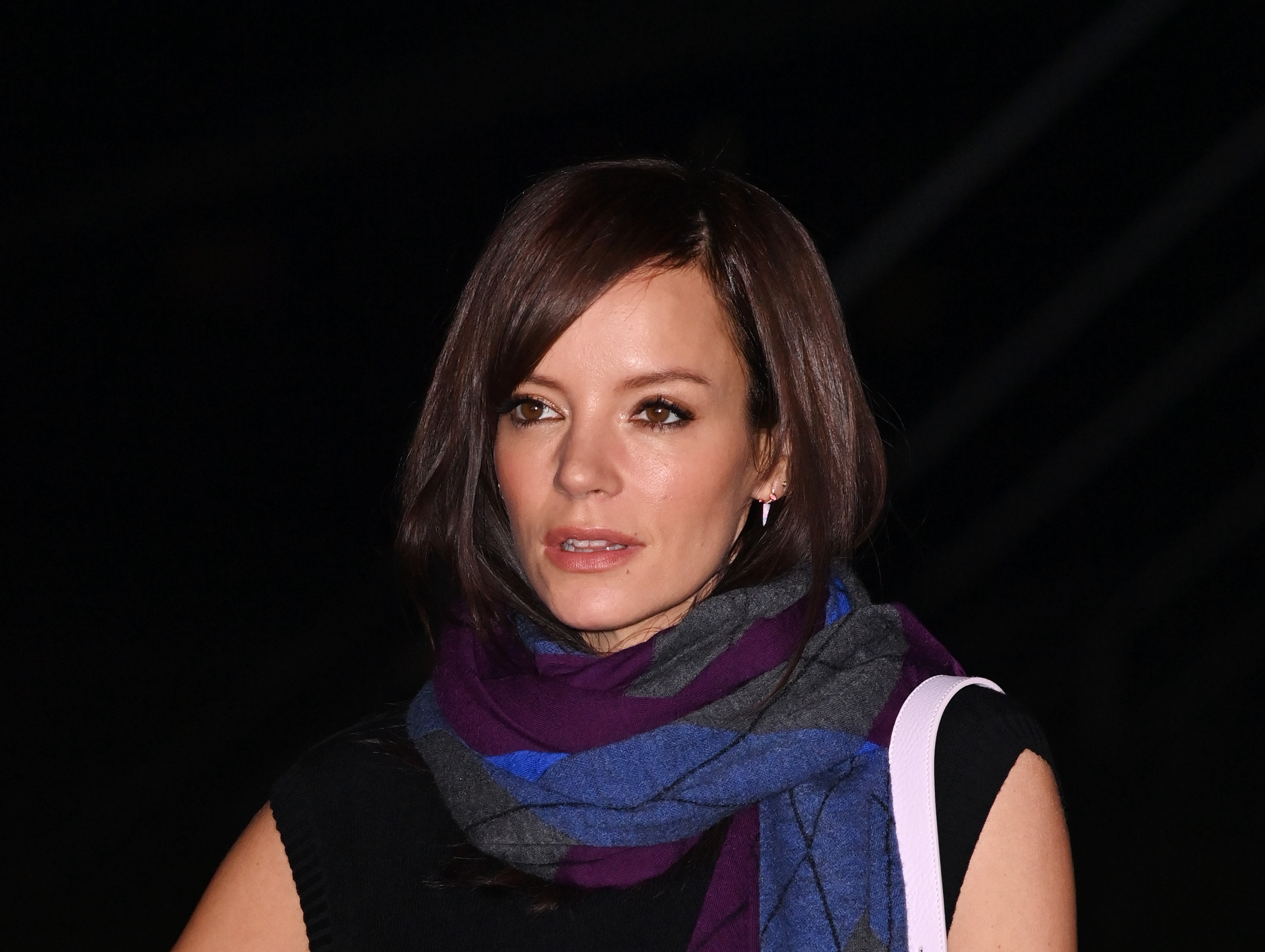 LONDON, ENGLAND - FEBRUARY 19: Lily Allen attends the Burberry Winter 2024 show during London Fashion Week on February 19, 2024 in London, England.