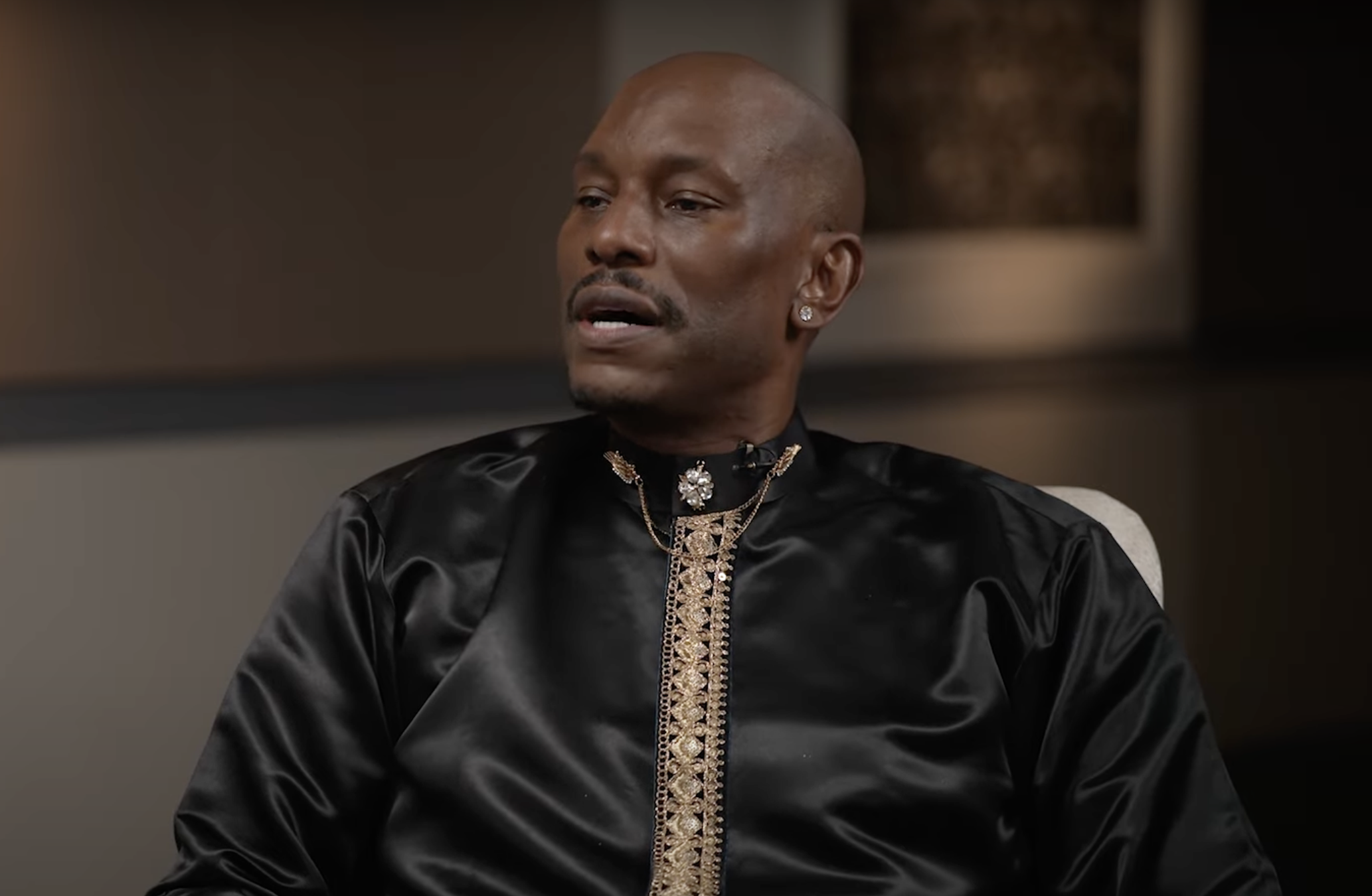 Screenshot of Tyrese Gibson in black shirt during interview with Shannon Sharpe.