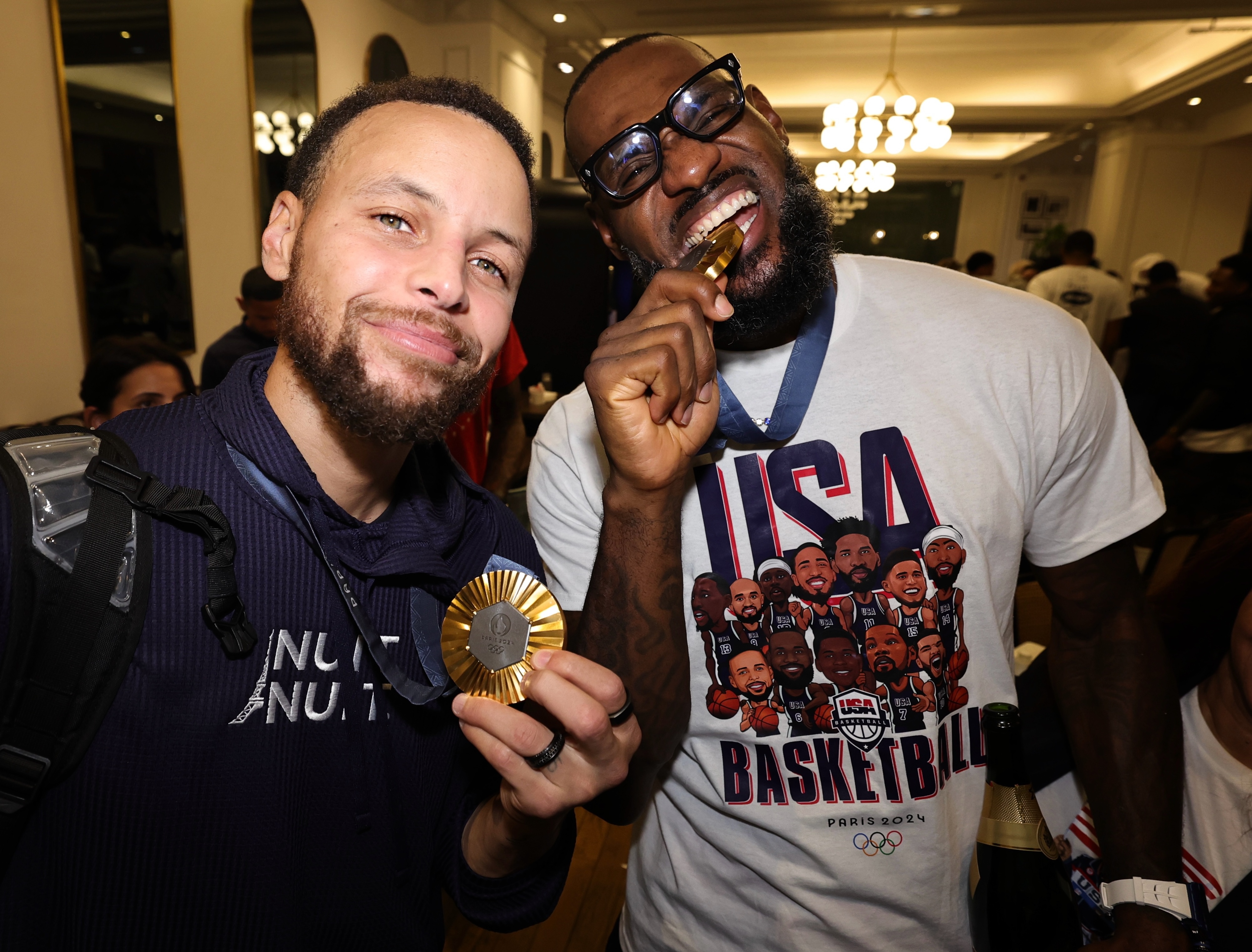 Stephen Curry #4 and LeBron James #6 of the USA Men's National Team returns to the hotel after winning the Gold against France on August 10, 2024 in Paris, France. 