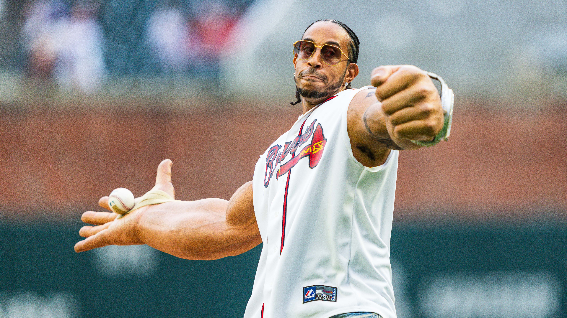 Ludacris throws out the ceremonial first pitch before the game between the Atlanta Braves and the Colorado Rockies.