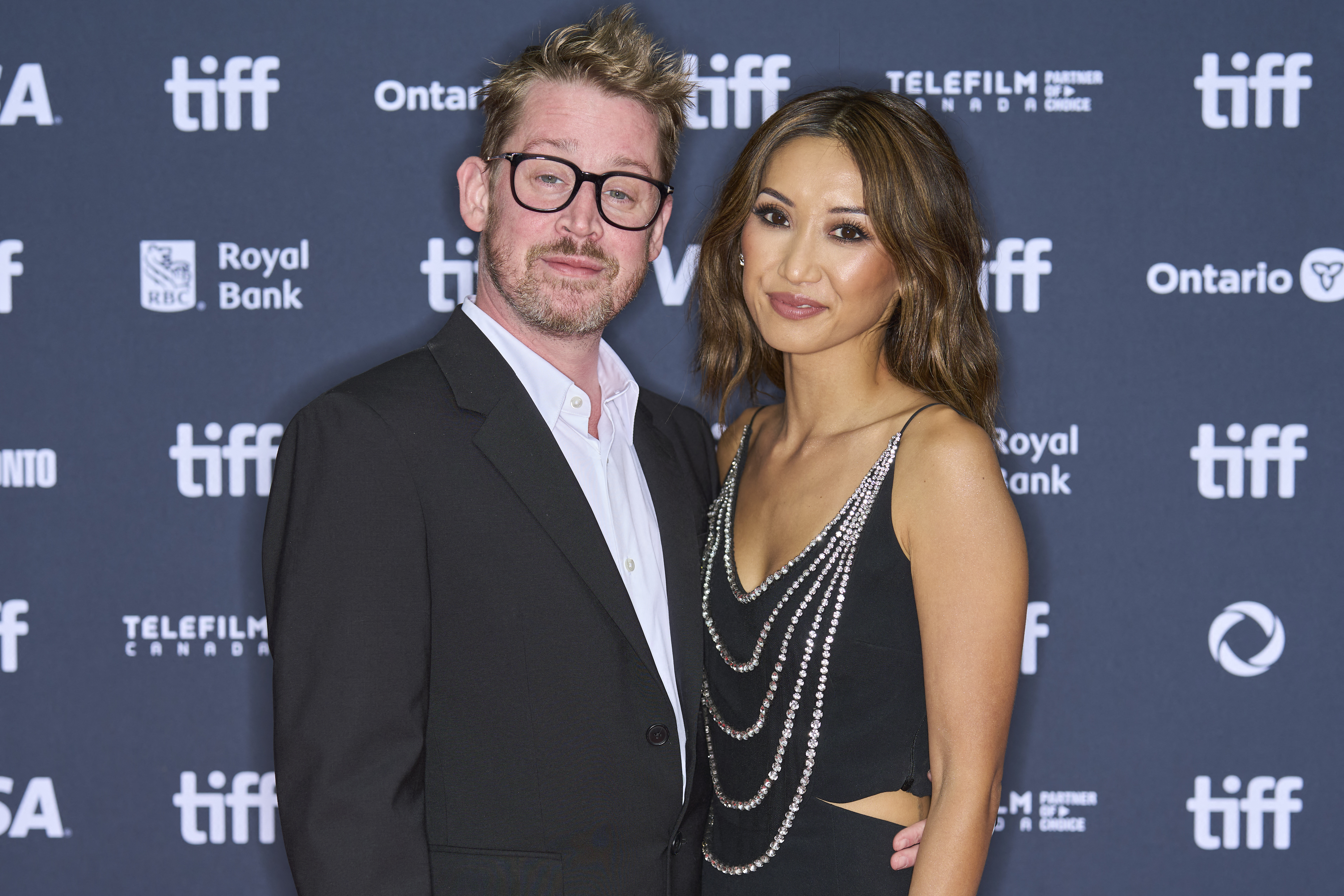 US actor Macaulay Culkin (L) and US actress Brenda Song attend the world premiere of "The Last Showgirl" during the Toronto International Film Festival at the Princess of Wales Theatre in Toronto, Ontario, Canada, on September 6, 2024. 