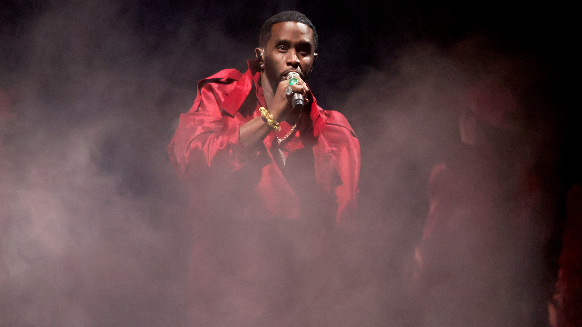 Diddy performs in red attire