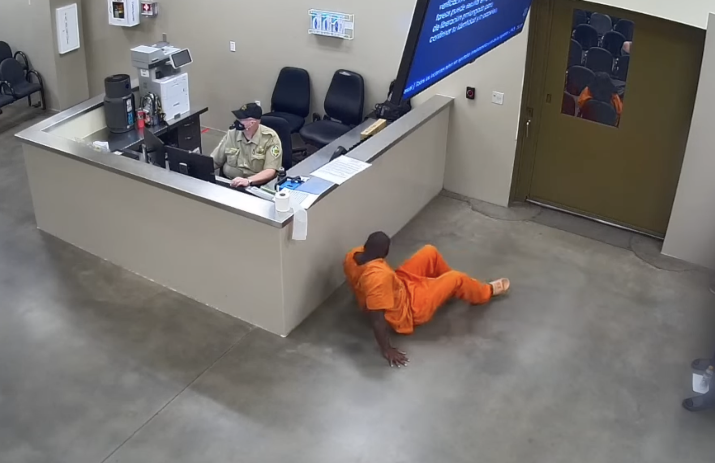 An inmate crawling to avoid detection.