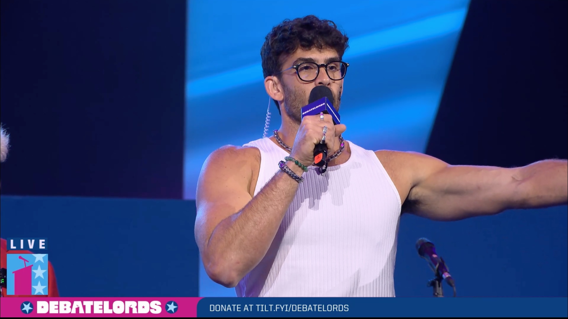 Hasan "HasanAbi" Piker stands on the DebateLords stage at 2024's TwitchCon in California.
