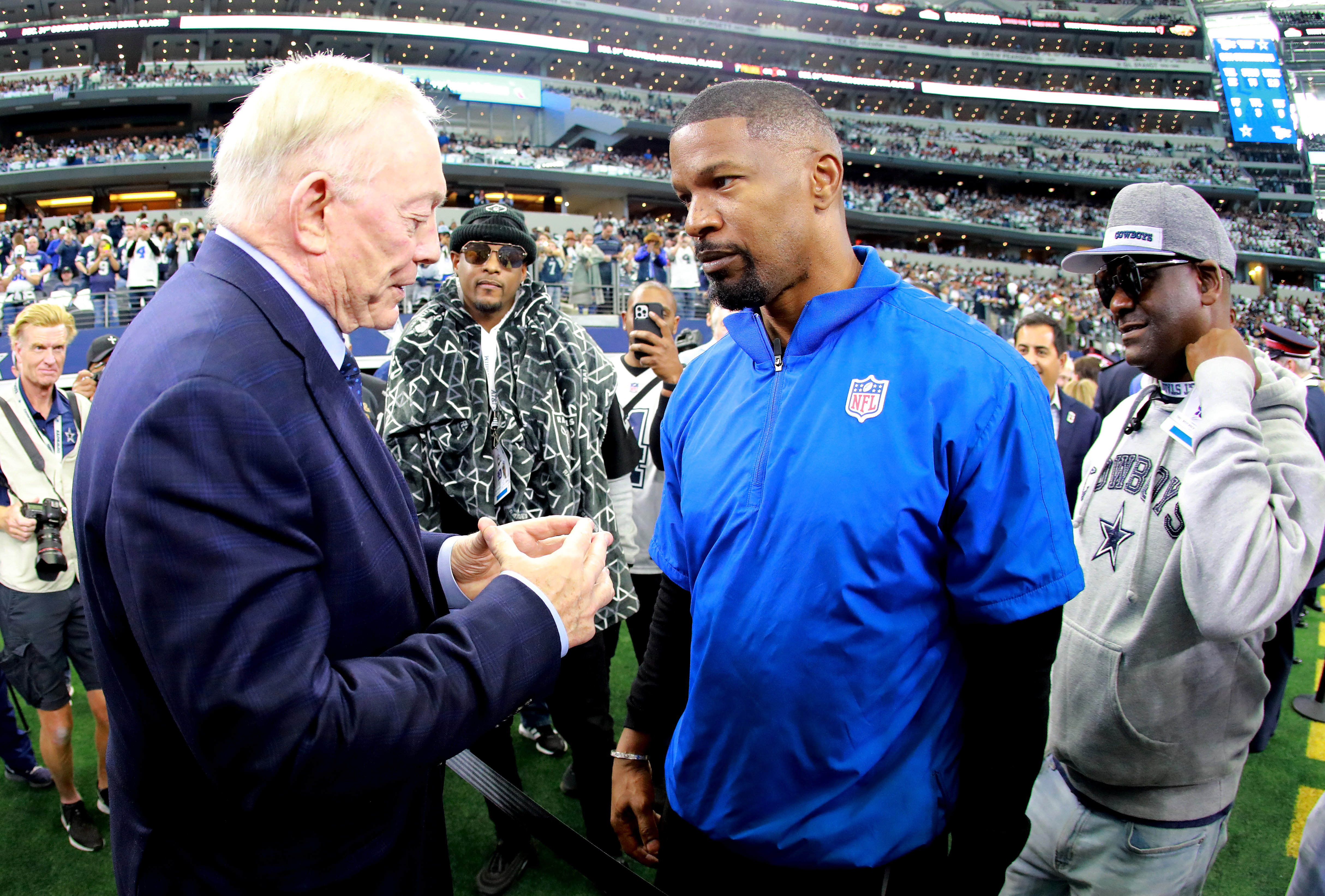 Dallas Cowboys owner Jerry Jones speaks to actor Jamie Foxx ahead of the NFL game between Las Vegas Raiders and Dallas Cowboys at AT&T Stadium on November 25, 2021 in Arlington, Texas.
