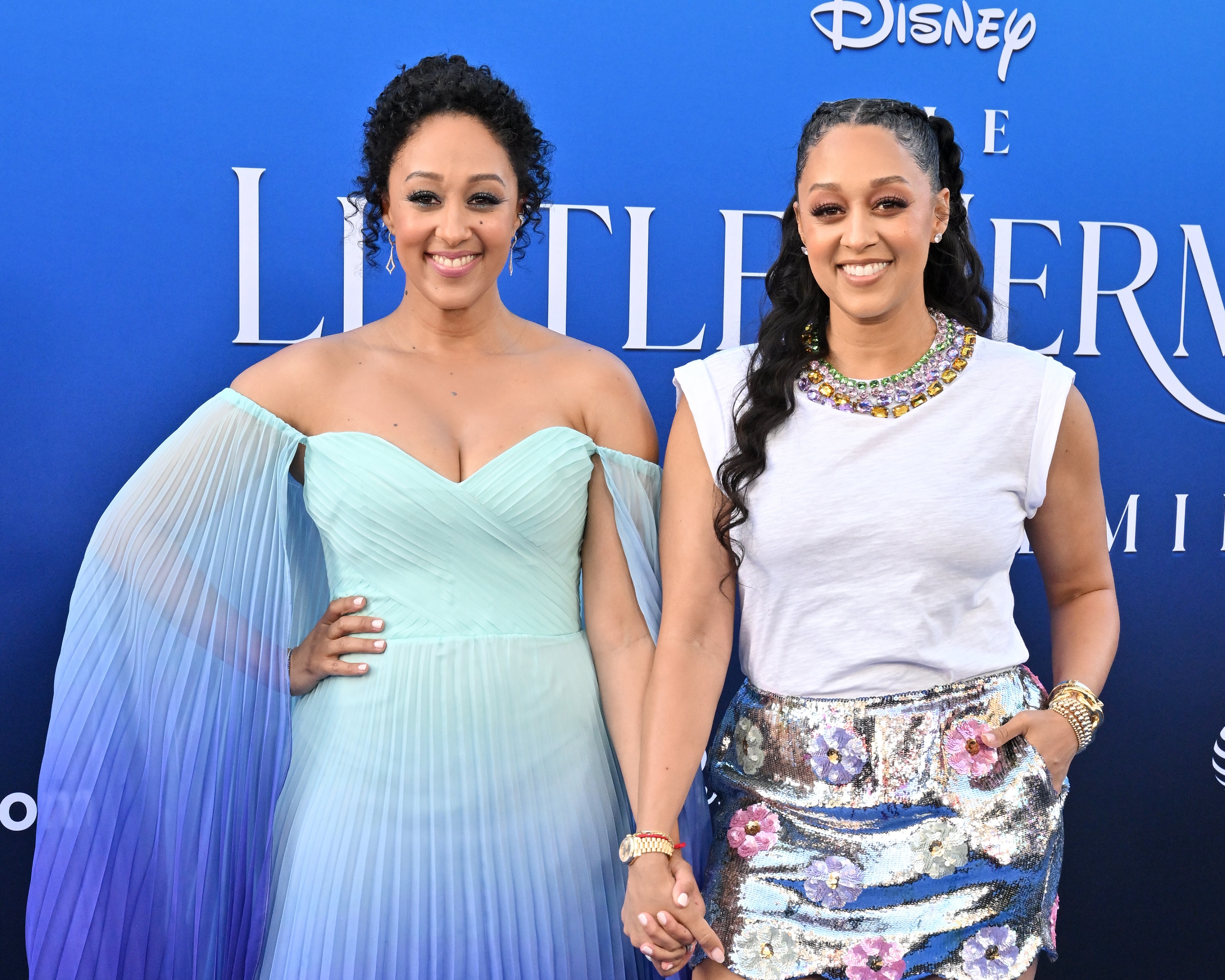 HOLLYWOOD, CALIFORNIA - MAY 08: Tamera Mowry and Tia Mowry attend the World Premiere of Disney's "The Little Mermaid" on May 08, 2023 in Hollywood, California.