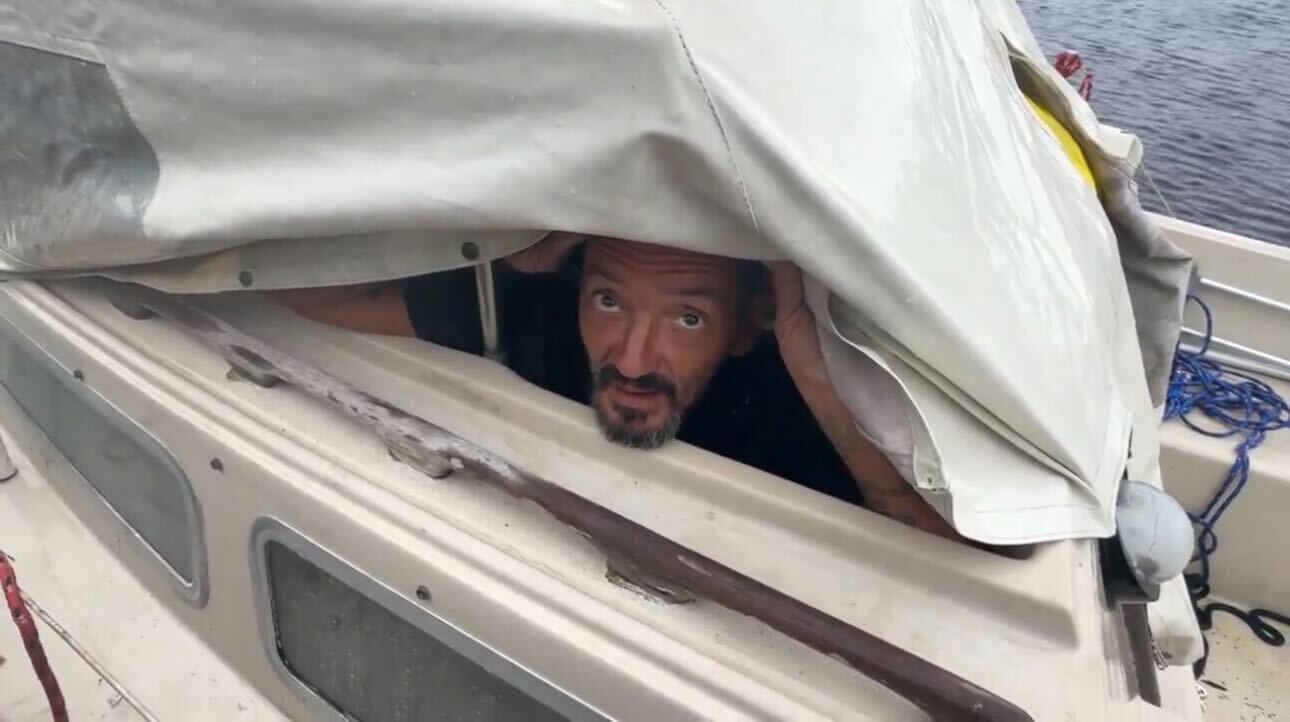 Lieutenant Dan hides in boat