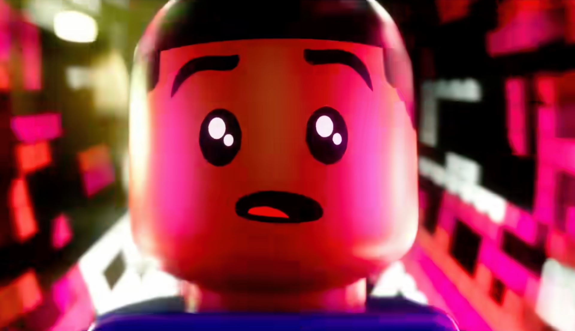 LEGO Pharrell Williams stares at the camera as colors refract from his eyes and face.