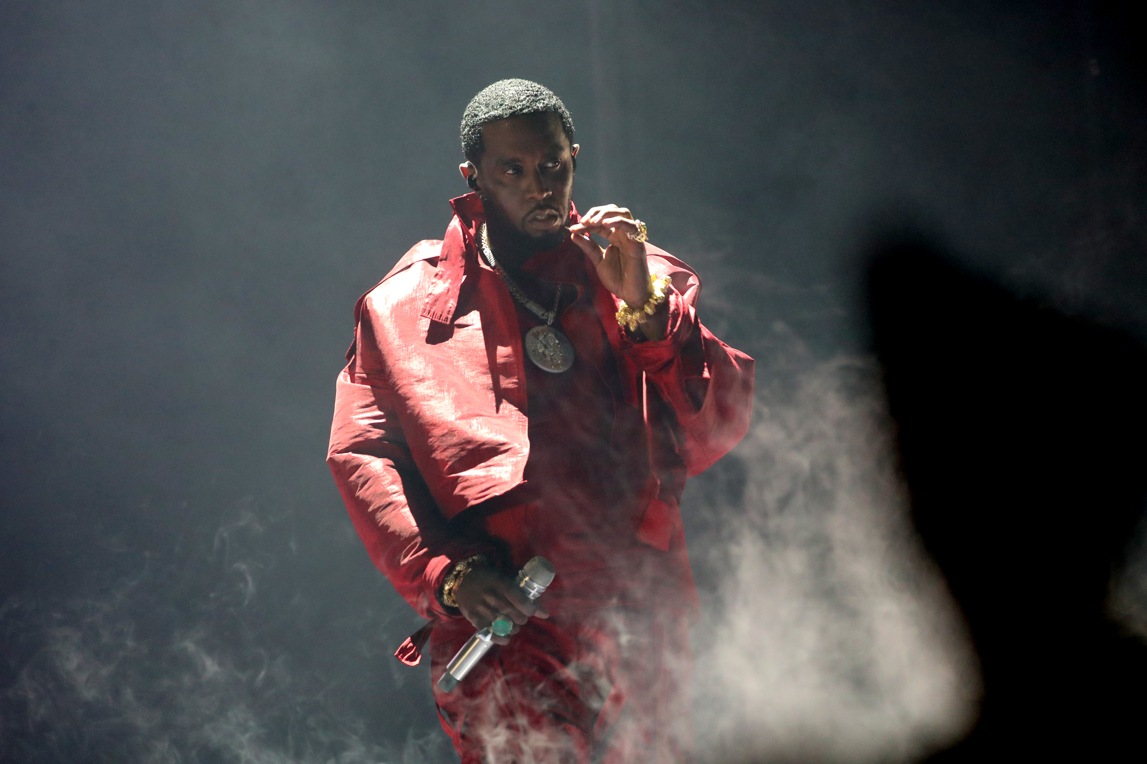 Diddy in red with smoke