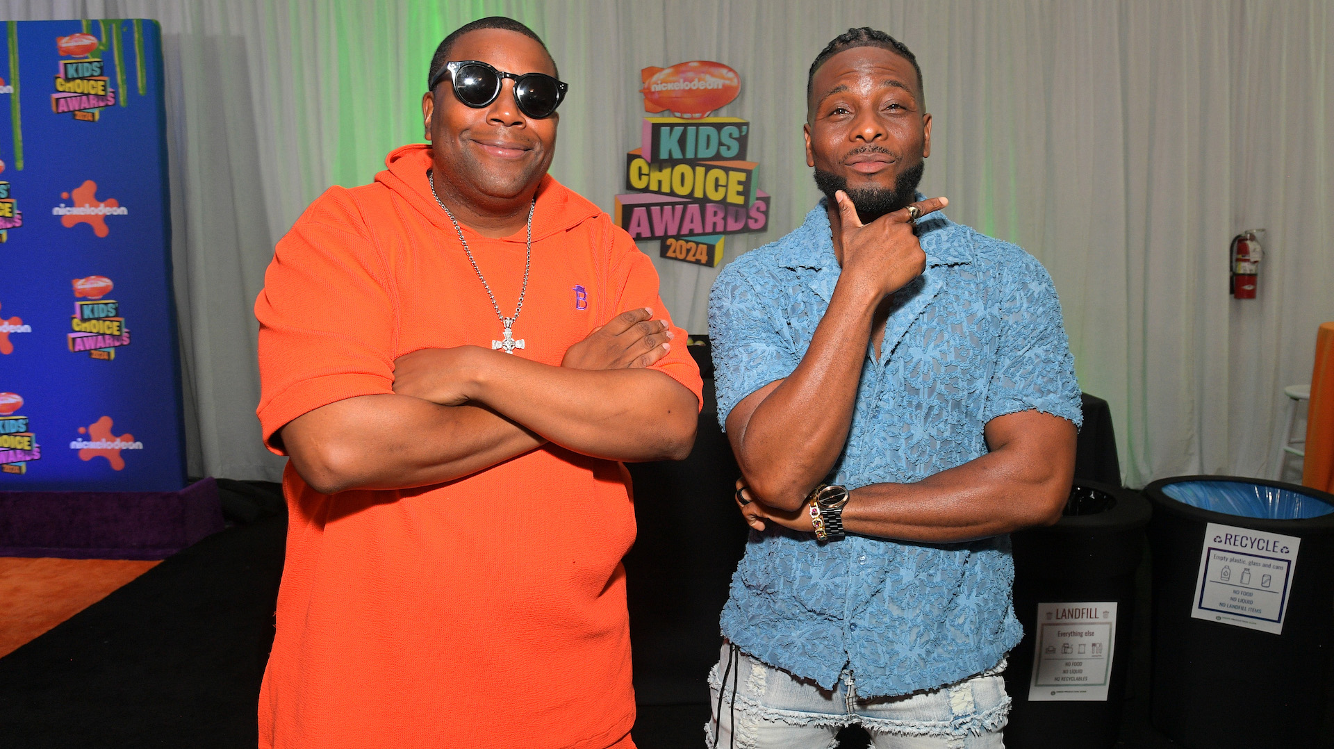 Kenan Thompson and Kel Mitchell at the Kids' Choice Awards 2024, posing with arms crossed and smiling.