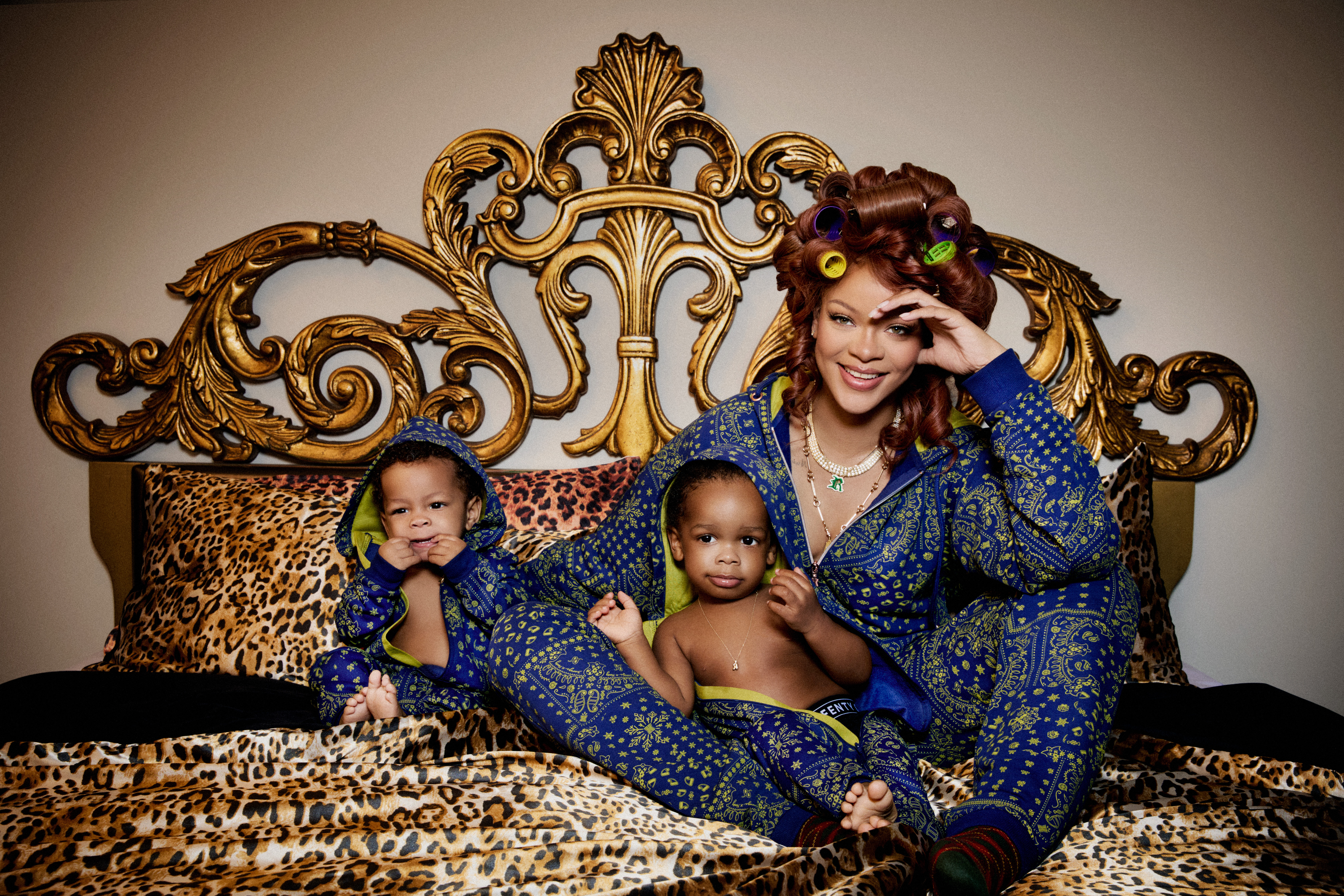 Rihanna, RZA, and Riot wearing the Forever Savage Hooded Onesies.