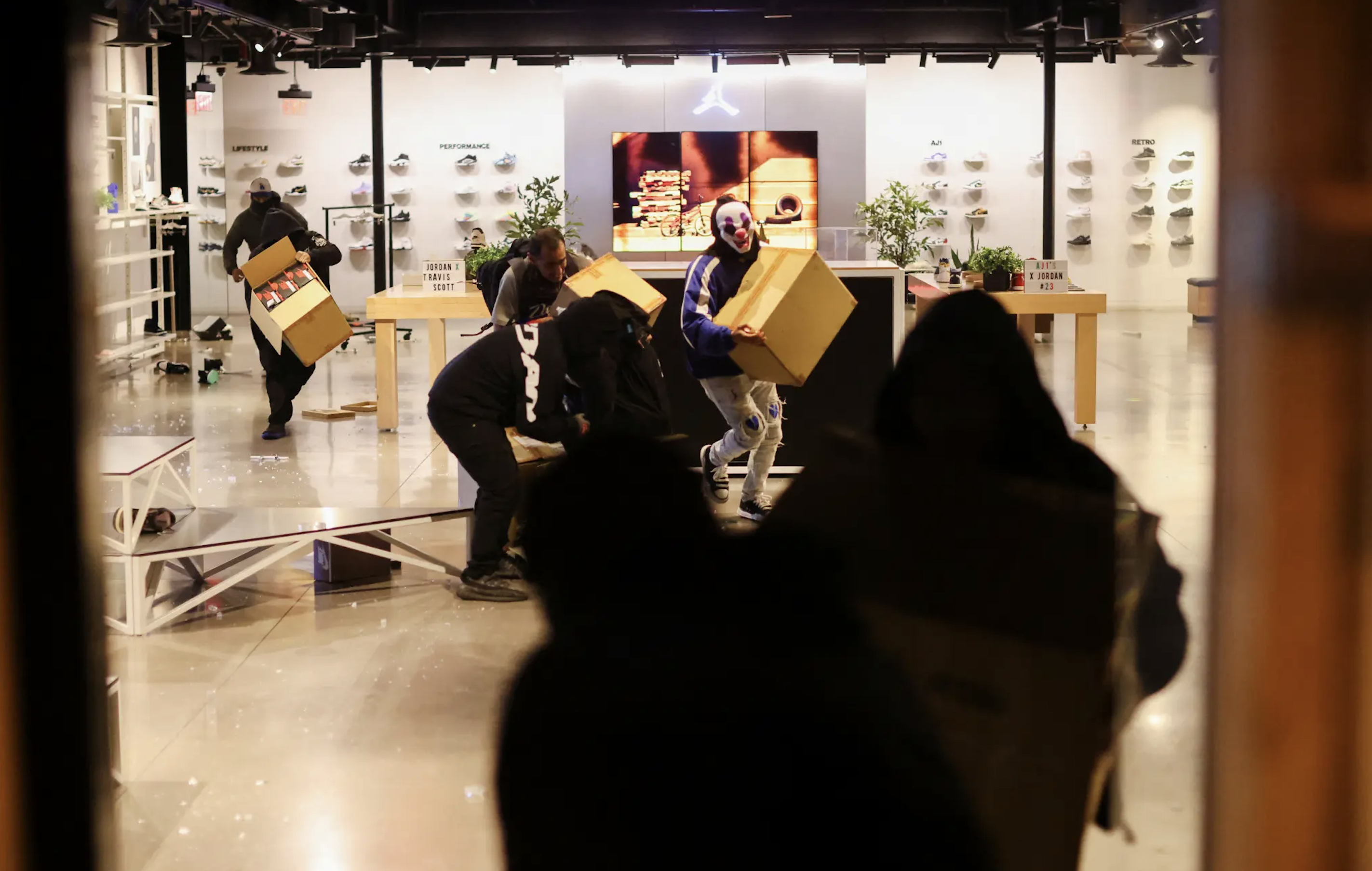 Looters seen stealing from the Jordan store in Los Angeles.