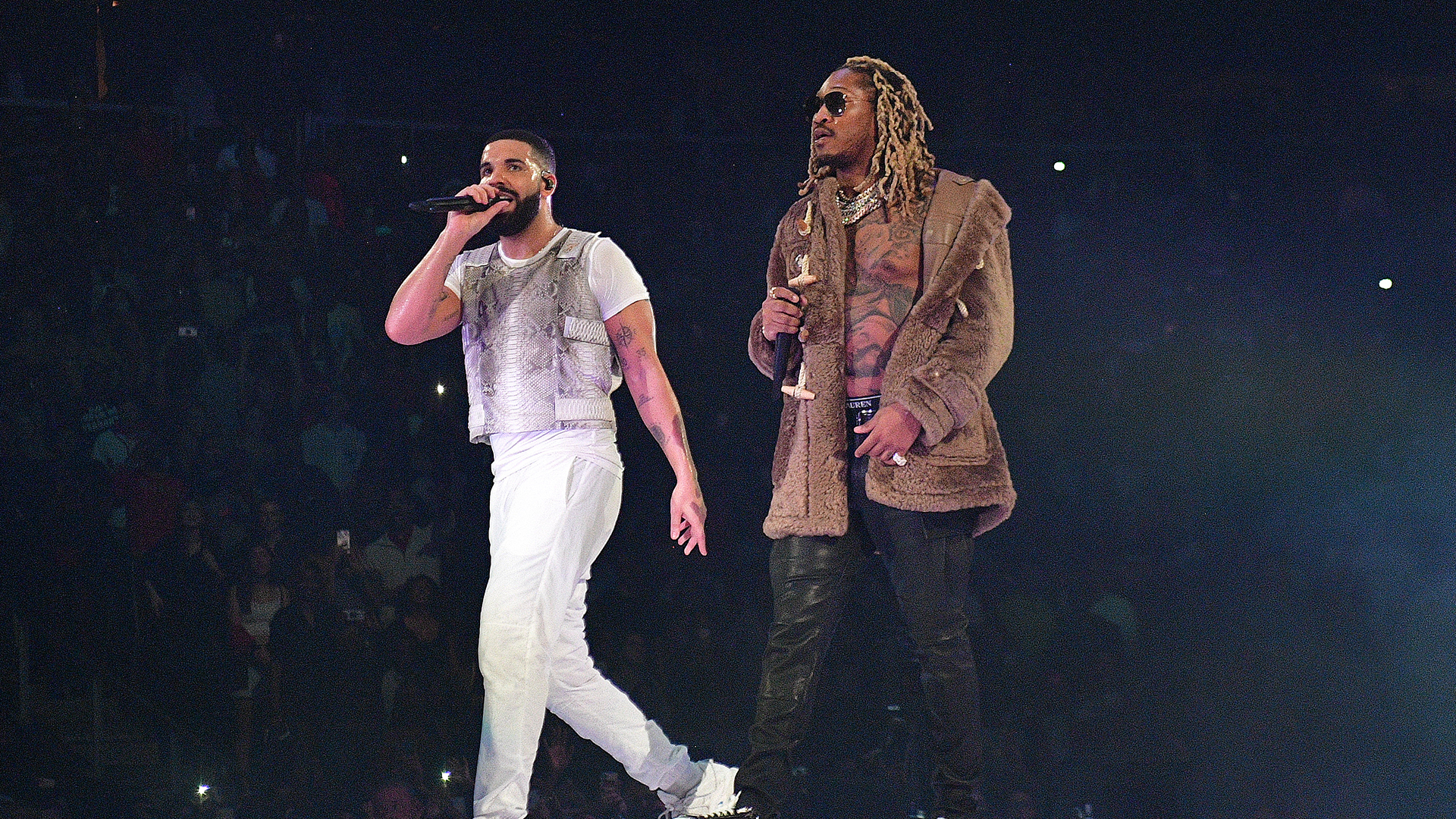Drake and Future perform onstage.