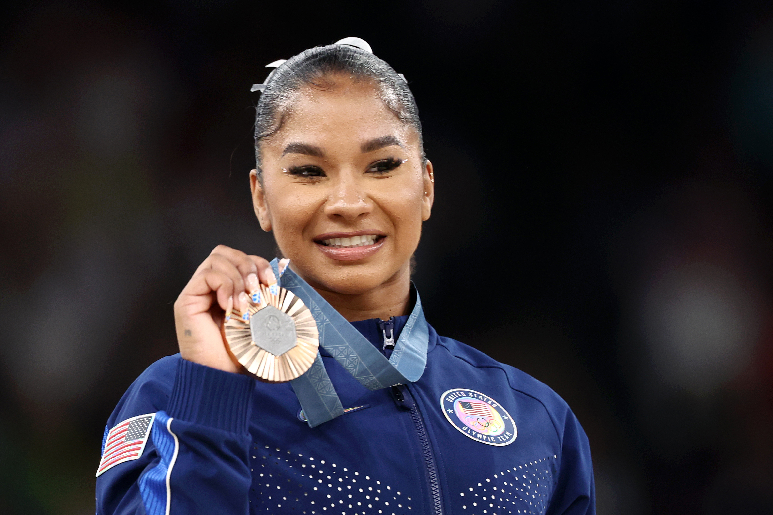 PARIS, FRANCE - AUGUST 05: Jordan Chiles of Team USA looks on with her Bronze Medal from the Women's Apparatus floor final on day ten of the Olympic Games Paris 2024 at Bercy Arena on August 05, 2024 in Paris, France.