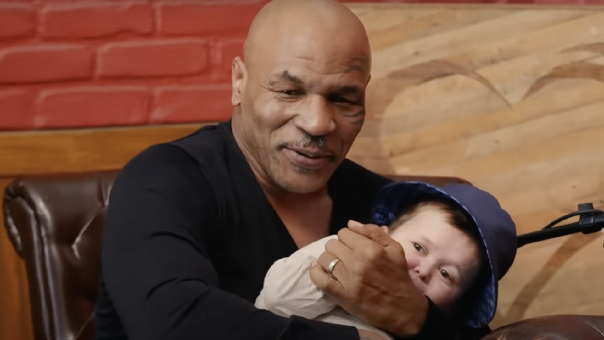 Mike Tyson holding Hasbulla