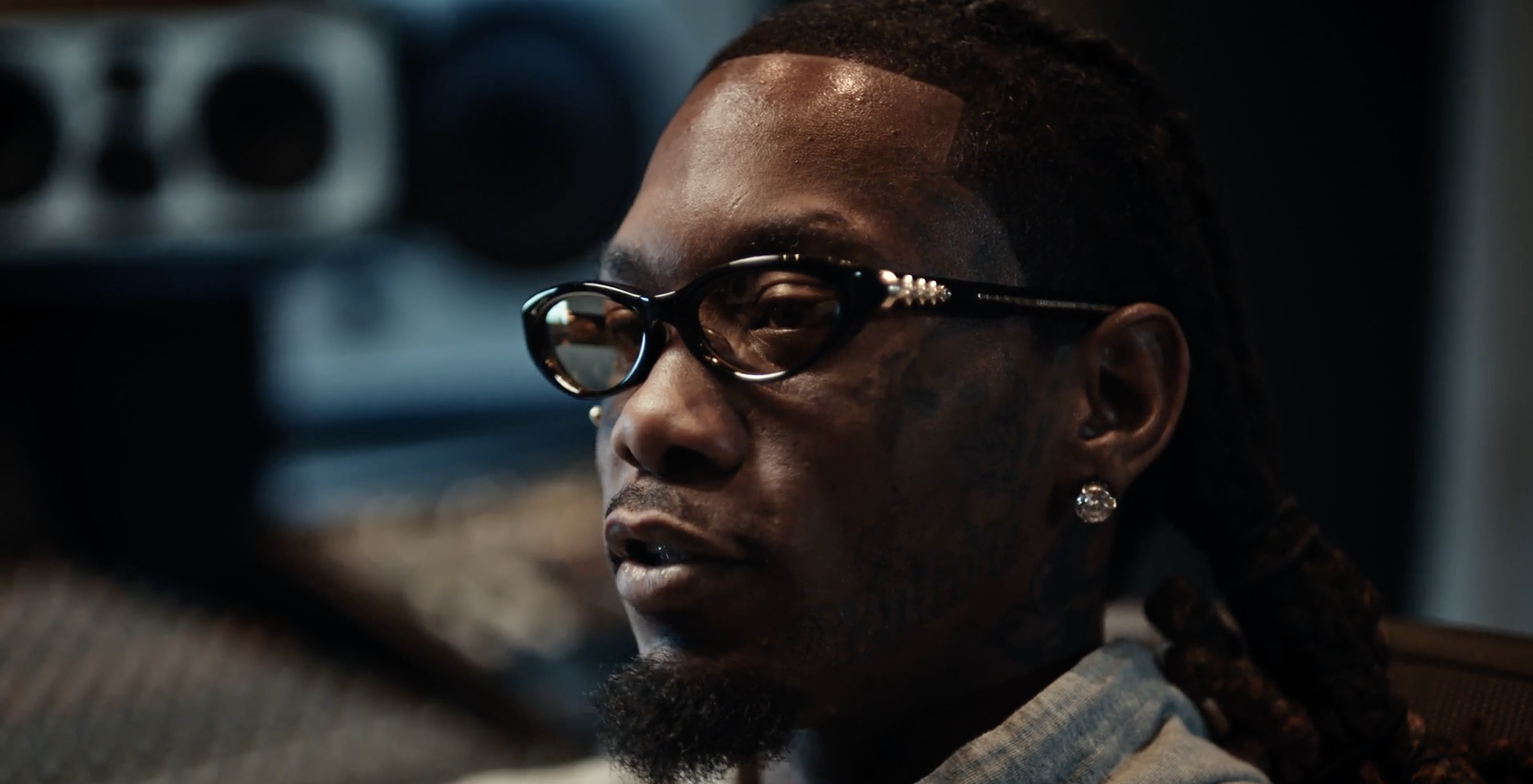Offset in a recording studio, looking thoughtful.