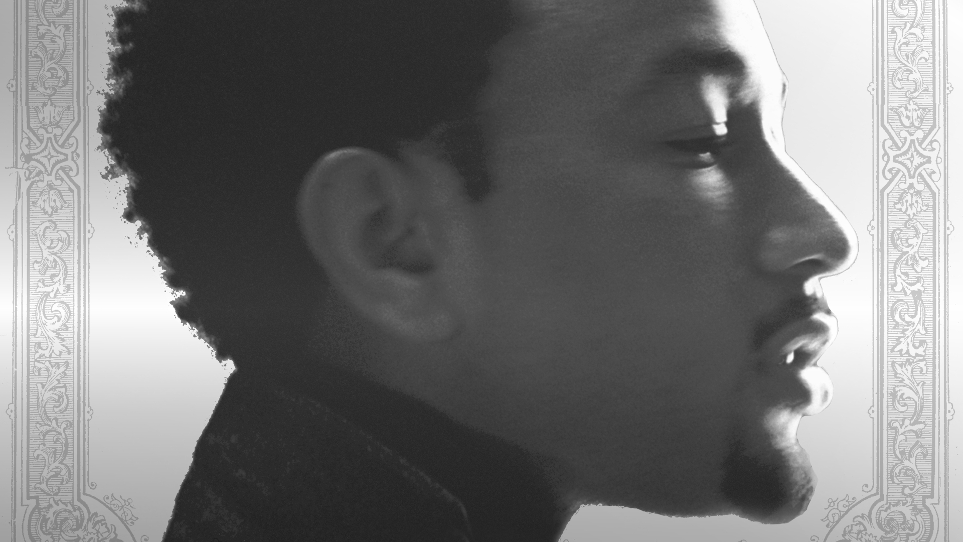 Profile of John Legend in black and white, with ornate border design.