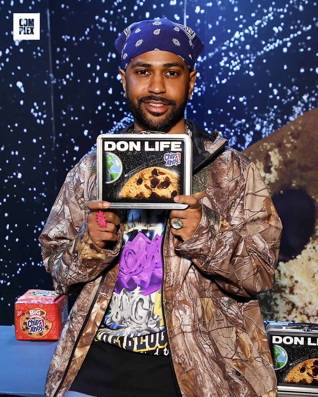 Merchandise featuring Big Sean and Chips Ahoy! includes black T-shirts, lunchboxes, a cookie-themed bag, and cookie packs.