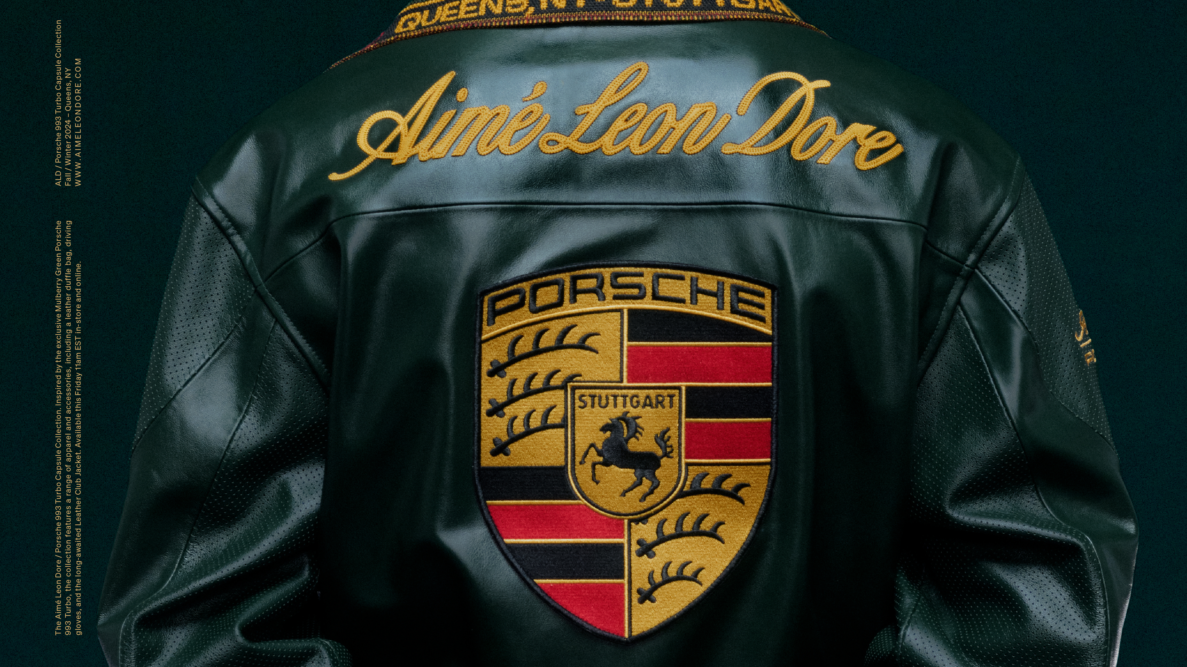 Back of a black leather jacket featuring "Aimé Leon Dore" in gold script and a large Porsche Stuttgart crest emblem.
